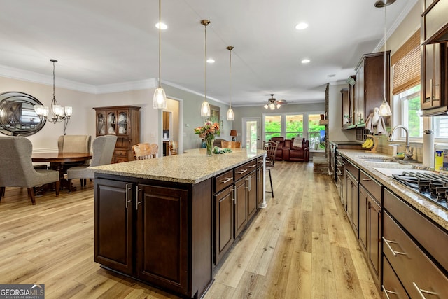 733 Firefly Ct, Griffin, GA 30223 - kitchen featuring a sink, light wood finished floors, open floor plan, recessed lighting, and a ceiling fan