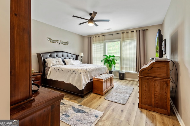 733 Firefly Ct, Griffin, GA 30223 - bedroom featuring light wood finished floors and a ceiling fan