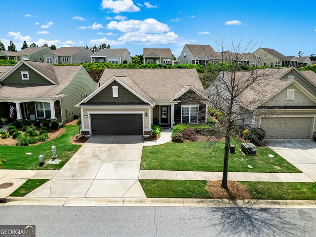 733 Firefly Ct, Griffin, GA 30223 - view of front of property with a residential view, concrete driveway, and a garage