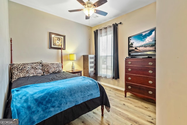 733 Firefly Ct, Griffin, GA 30223 - bedroom featuring light wood finished floors, baseboards, and ceiling fan