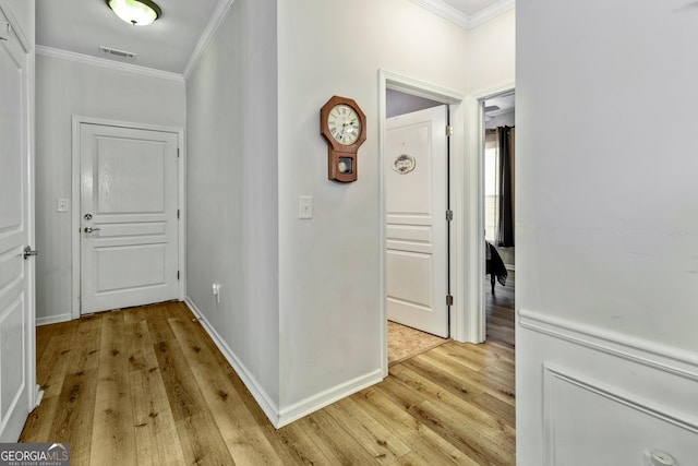 733 Firefly Ct, Griffin, GA 30223 - hallway featuring crown molding, light wood finished floors, and baseboards