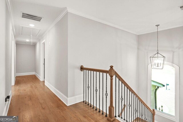 3298 Alcovy Club Ct, Dacula, GA 30019 - corridor featuring attic access, an upstairs landing, wood finished floors, ornamental molding, and baseboards