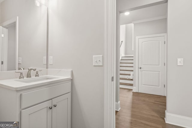 3298 Alcovy Club Ct, Dacula, GA 30019 - bathroom featuring baseboards, wood finished floors, and vanity