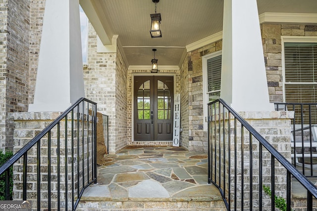3298 Alcovy Club Ct, Dacula, GA 30019 - view of exterior entry featuring french doors, stone siding, and a porch