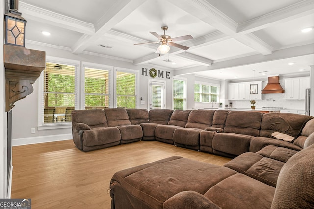 3298 Alcovy Club Ct, Dacula, GA 30019 - living area featuring coffered ceiling, light wood-style floors, beam ceiling, plenty of natural light, and crown molding