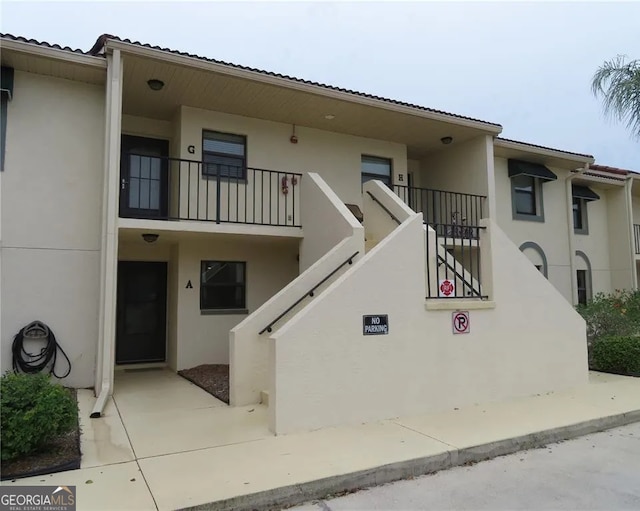 26461 Explorer Rd Unit A, Punta Gorda, FL 33983 - view of building exterior with stairway