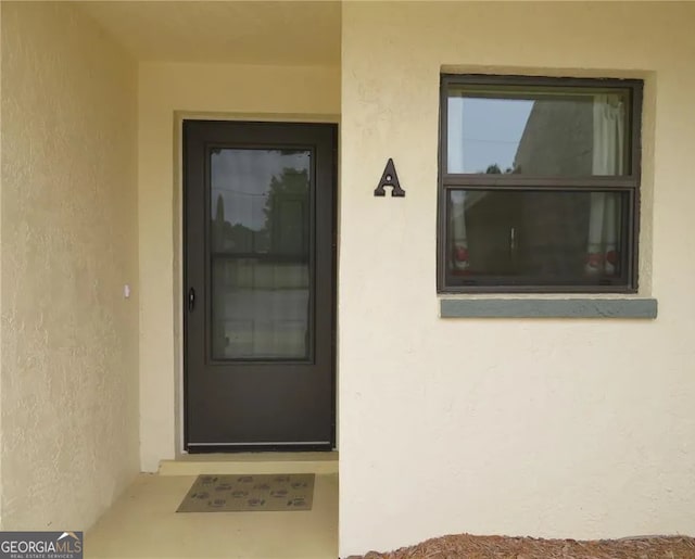 26461 Explorer Rd Unit A, Punta Gorda, FL 33983 - property entrance featuring stucco siding