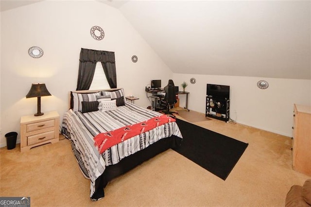 bedroom with carpet and lofted ceiling