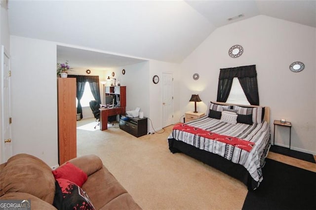 carpeted bedroom featuring vaulted ceiling