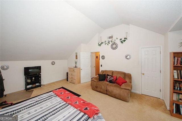 carpeted bedroom featuring vaulted ceiling
