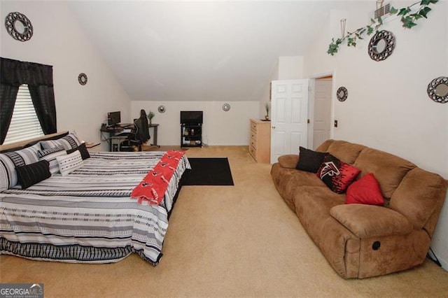 bedroom featuring vaulted ceiling and carpet floors