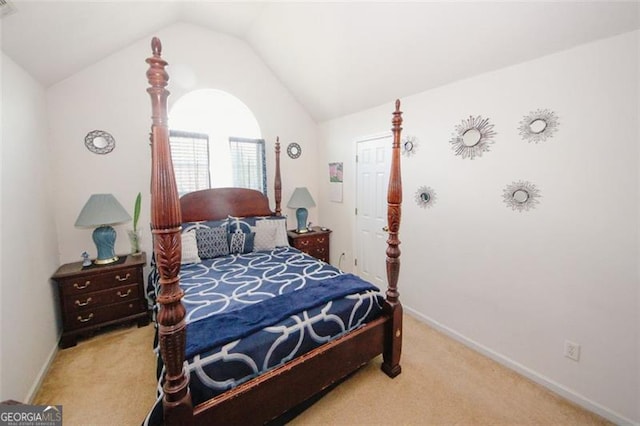 bedroom featuring carpet, lofted ceiling, and baseboards