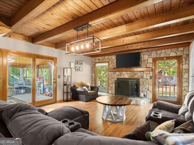 665 Mcclain Mountain Rd, Jasper, GA 30143 - living room with a wooden ceiling with exposed beams, wood finished floors, plenty of natural light, and a fireplace