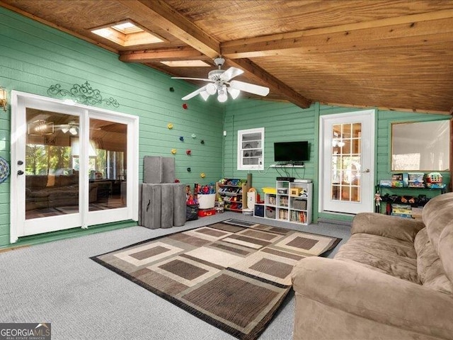 665 Mcclain Mountain Rd, Jasper, GA 30143 - living room featuring wood ceiling, a ceiling fan, carpet flooring, and wooden walls