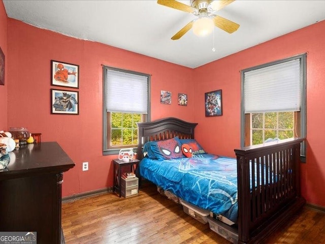 665 Mcclain Mountain Rd, Jasper, GA 30143 - bedroom featuring multiple windows, wood-type flooring, and a ceiling fan