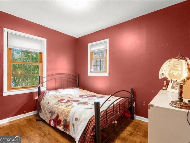 665 Mcclain Mountain Rd, Jasper, GA 30143 - bedroom featuring multiple windows and wood finished floors