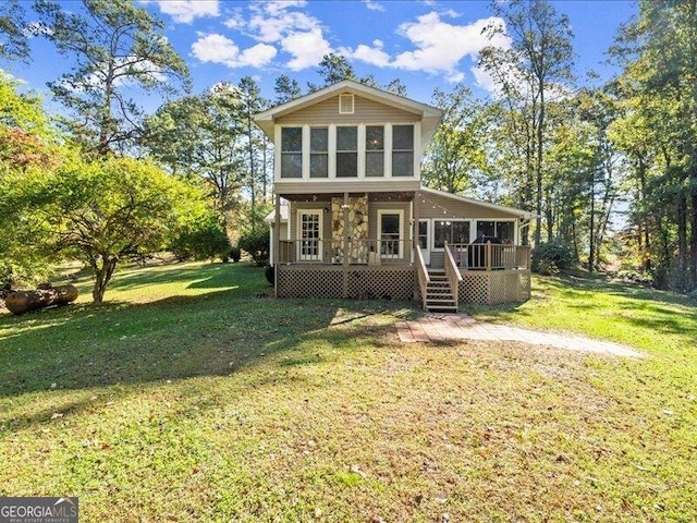665 Mcclain Mountain Rd, Jasper, GA 30143 - back of property with a deck, a yard, and a sunroom