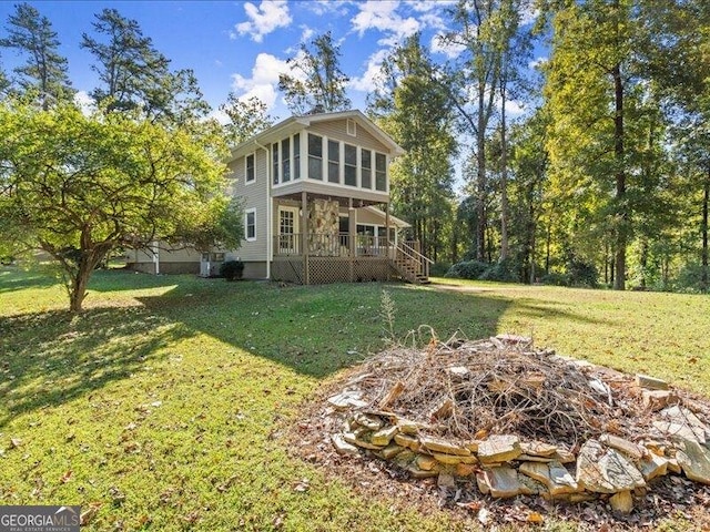 665 Mcclain Mountain Rd, Jasper, GA 30143 - rear view of house with a lawn and stairs