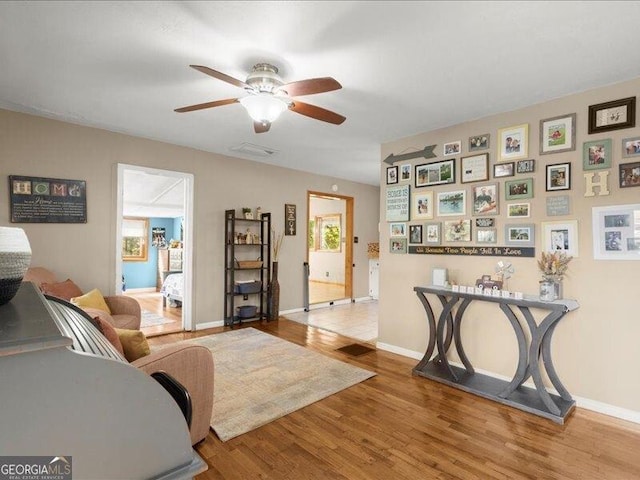 665 Mcclain Mountain Rd, Jasper, GA 30143 - living area with ceiling fan, wood finished floors, and plenty of natural light