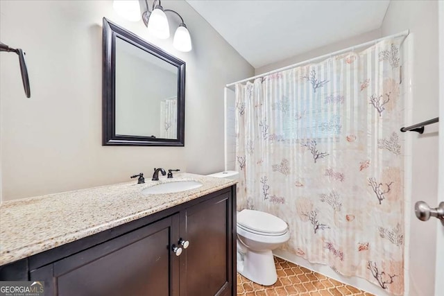bathroom with toilet, vanity, a shower with shower curtain, and tile patterned flooring