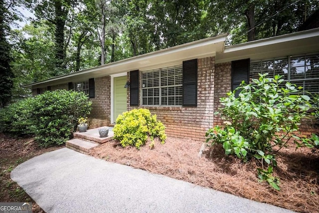 view of front of property featuring brick siding