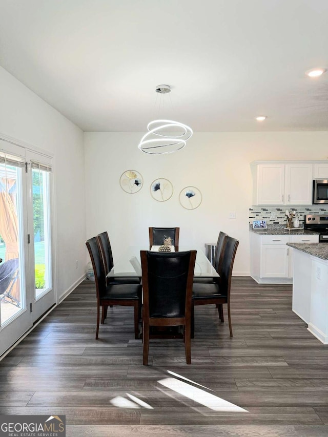 189 Bentwater Way, Hoschton, GA 30548 - dining space with dark wood-style flooring, recessed lighting, and a chandelier