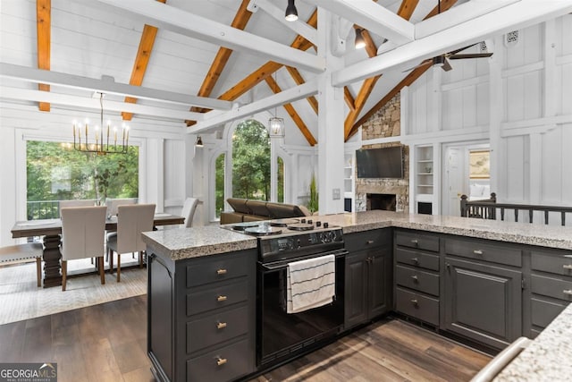 1560 Parks Mill Dr, Greensboro, GA 30642 - kitchen featuring black range with electric cooktop, a chandelier, open floor plan, dark wood finished floors, and beamed ceiling