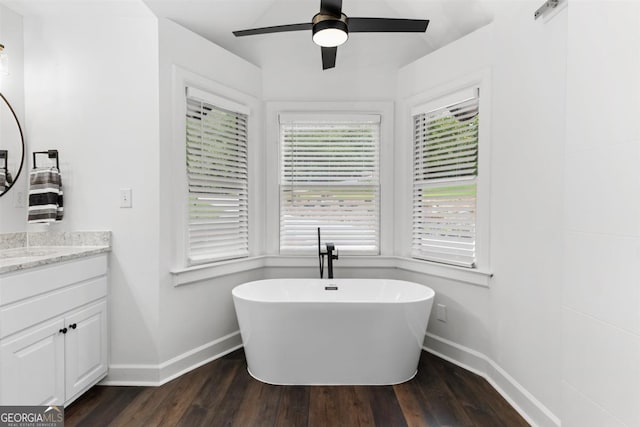 1560 Parks Mill Dr, Greensboro, GA 30642 - full bath featuring baseboards, a ceiling fan, and wood finished floors
