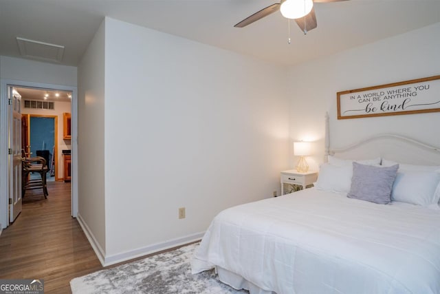 1560 Parks Mill Dr, Greensboro, GA 30642 - bedroom featuring wood finished floors, attic access, baseboards, and ceiling fan