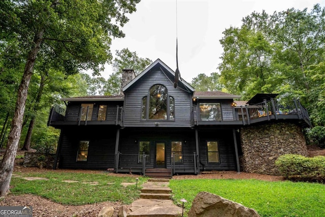 1560 Parks Mill Dr, Greensboro, GA 30642 - view of front of home featuring a balcony, a chimney, and a front lawn