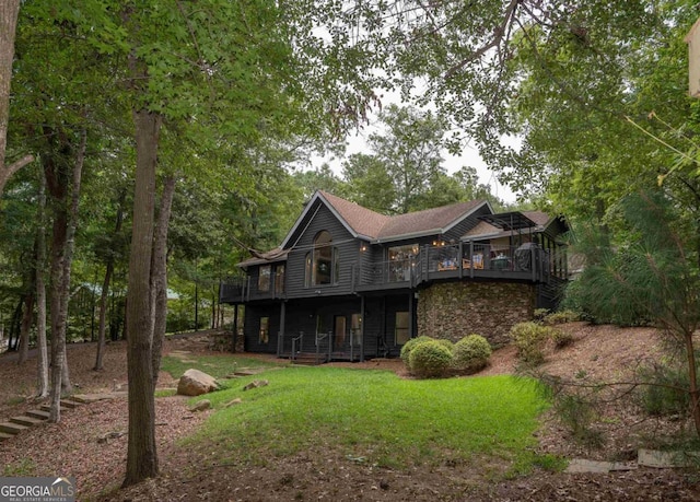 1560 Parks Mill Dr, Greensboro, GA 30642 - rear view of house featuring a lawn, stone siding, and a porch