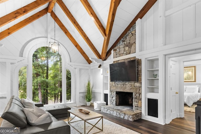1560 Parks Mill Dr, Greensboro, GA 30642 - living area with wood finished floors, high vaulted ceiling, beamed ceiling, built in features, and a stone fireplace