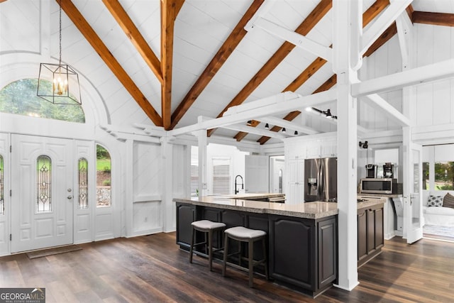 1560 Parks Mill Dr, Greensboro, GA 30642 - kitchen featuring stainless steel appliances, dark wood-style flooring, high vaulted ceiling, a large island with sink, and beamed ceiling