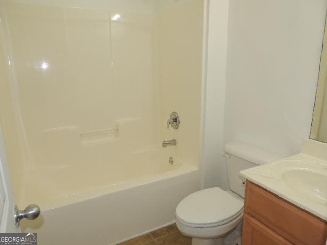 full bathroom with toilet, vanity, shower / bath combination, and tile patterned flooring