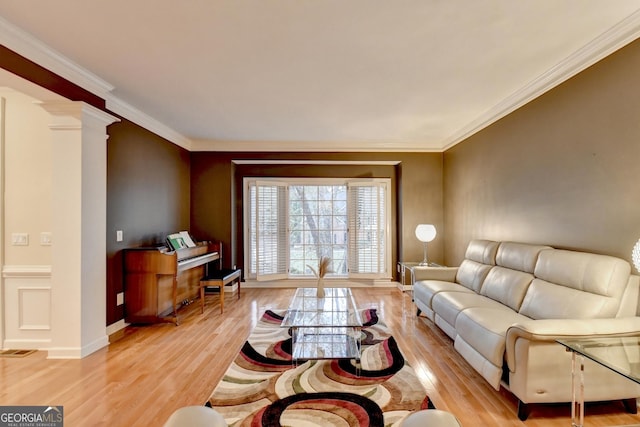 3565 Hickory Branch Trl, Suwanee, GA 30024 - living room with light wood-style flooring, decorative columns, and crown molding