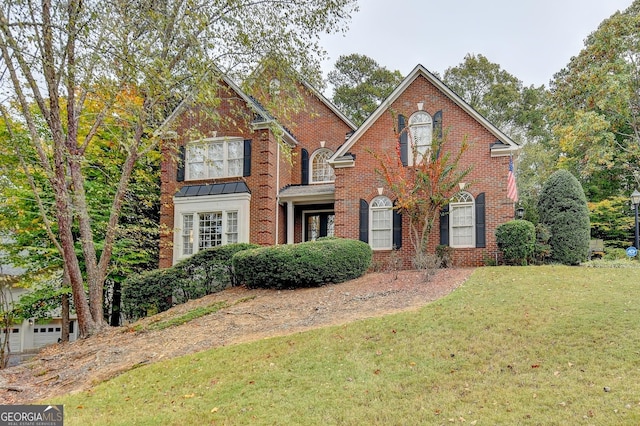 3565 Hickory Branch Trl, Suwanee, GA 30024 - traditional-style home with a front lawn and brick siding