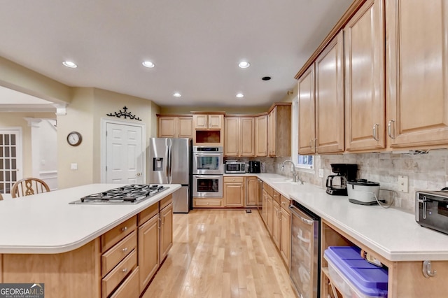 3565 Hickory Branch Trl, Suwanee, GA 30024 - kitchen with appliances with stainless steel finishes, light wood-type flooring, recessed lighting, backsplash, and light countertops