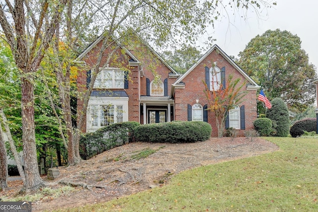 3565 Hickory Branch Trl, Suwanee, GA 30024 - colonial home with brick siding and a front yard