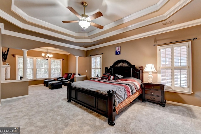 3565 Hickory Branch Trl, Suwanee, GA 30024 - bedroom featuring arched walkways, decorative columns, a tray ceiling, a chandelier, and carpet