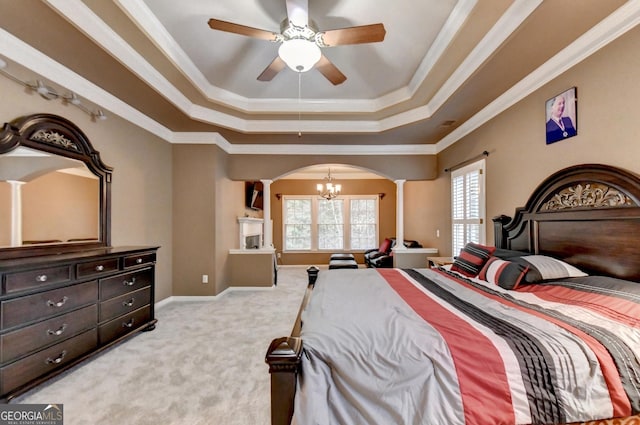 3565 Hickory Branch Trl, Suwanee, GA 30024 - bedroom featuring decorative columns, arched walkways, a chandelier, a tray ceiling, and light carpet