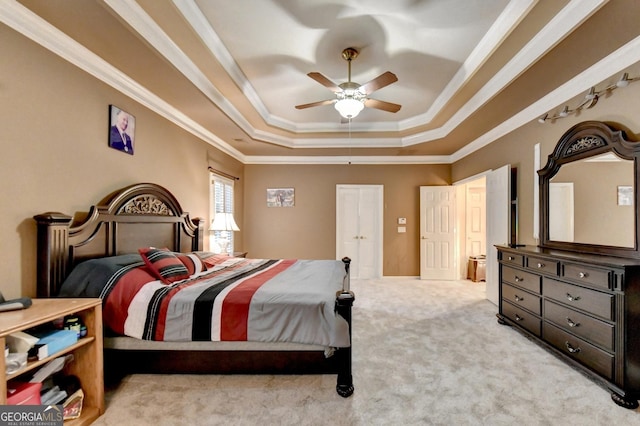 3565 Hickory Branch Trl, Suwanee, GA 30024 - carpeted bedroom with a tray ceiling, crown molding, and a ceiling fan