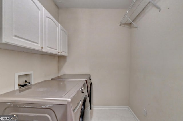 3565 Hickory Branch Trl, Suwanee, GA 30024 - laundry area featuring cabinet space and washer and dryer