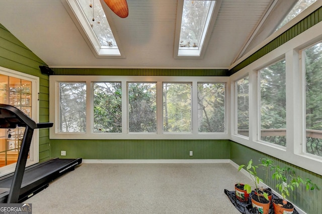 3565 Hickory Branch Trl, Suwanee, GA 30024 - unfurnished sunroom with a skylight, vaulted ceiling, healthy amount of natural light, carpet floors, and wood walls