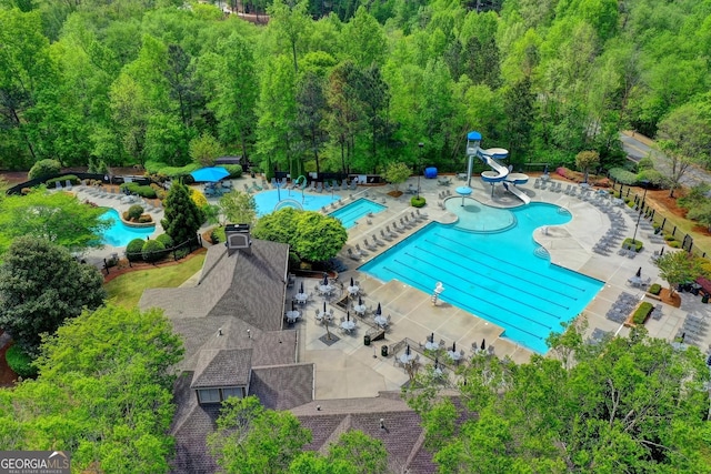 3565 Hickory Branch Trl, Suwanee, GA 30024 - community pool with a water slide and a patio