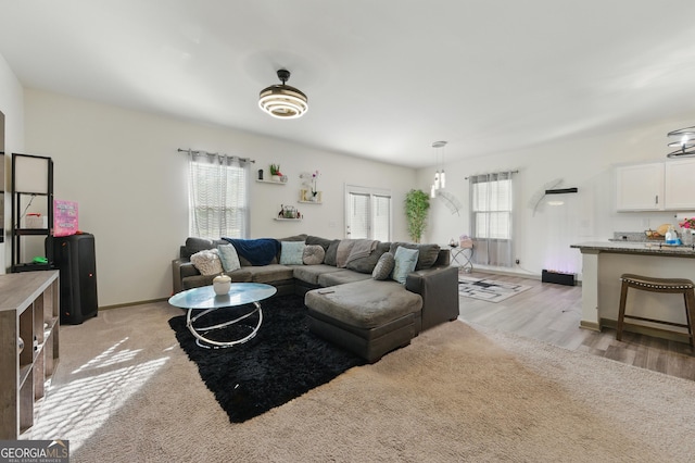 55 Knightsbridge Ln, Winder, GA 30680 - living area with healthy amount of natural light, light wood finished floors, and baseboards