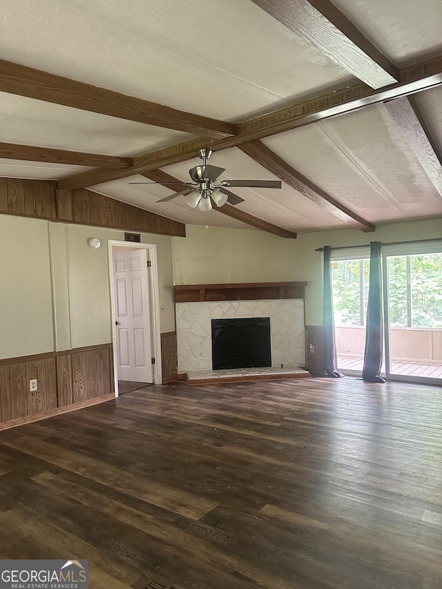 710 Seals Rd, Dallas, GA 30157 - unfurnished living room featuring ceiling fan, a wainscoted wall, wood finished floors, a fireplace, and wooden walls