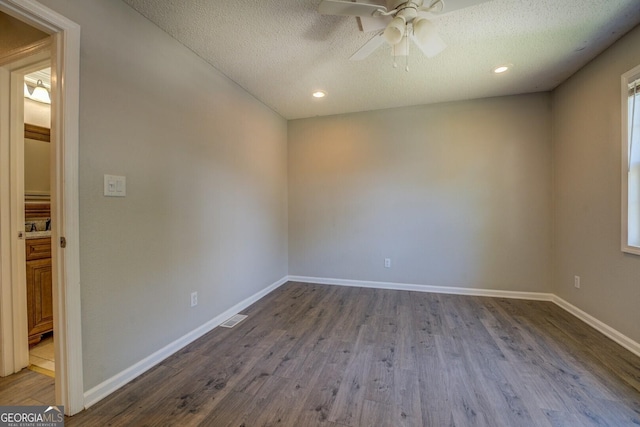 302 Atlanta Ave SE, Atlanta, GA 30315 - empty room featuring a textured ceiling, dark wood-style flooring, a ceiling fan, baseboards, and recessed lighting