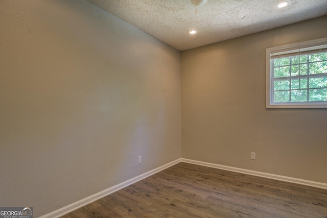 302 Atlanta Ave SE, Atlanta, GA 30315 - unfurnished room with dark wood-style floors, baseboards, recessed lighting, and a textured ceiling
