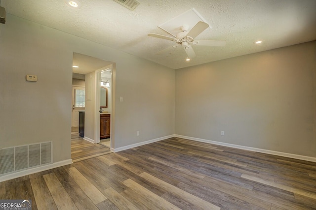 302 Atlanta Ave SE, Atlanta, GA 30315 - unfurnished room with wood finished floors, ceiling fan, a textured ceiling, baseboards, and recessed lighting