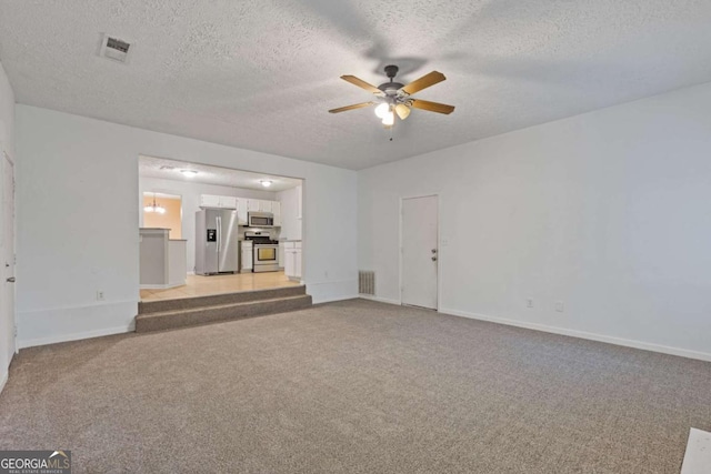2907 Oakvale Falls Dr, Decatur, GA 30034 - unfurnished living room with a ceiling fan, light carpet, a textured ceiling, and baseboards